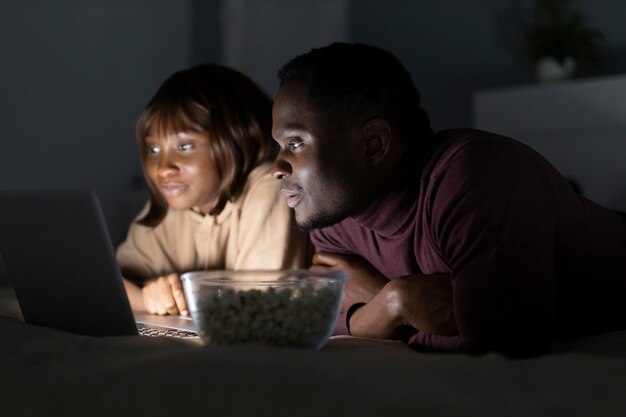 African american couple watching streaming service 