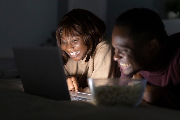 African american couple watching streaming service 