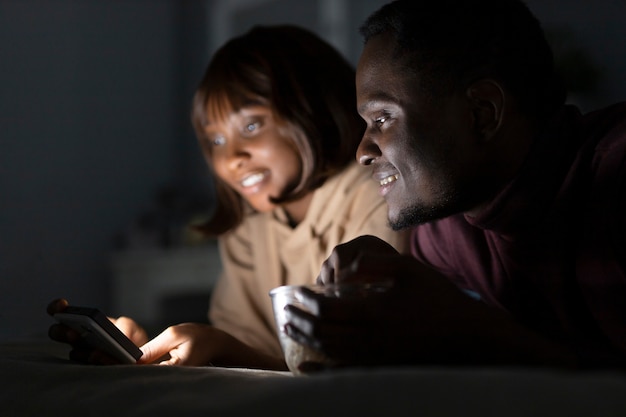 African american couple watching streaming service