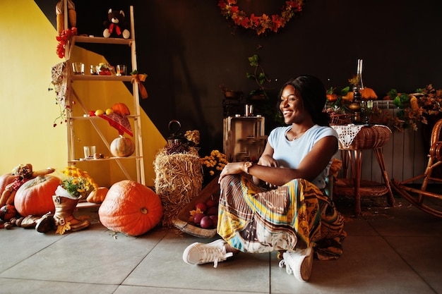 Free photo african american girl against autumn mood decoration fall in africa