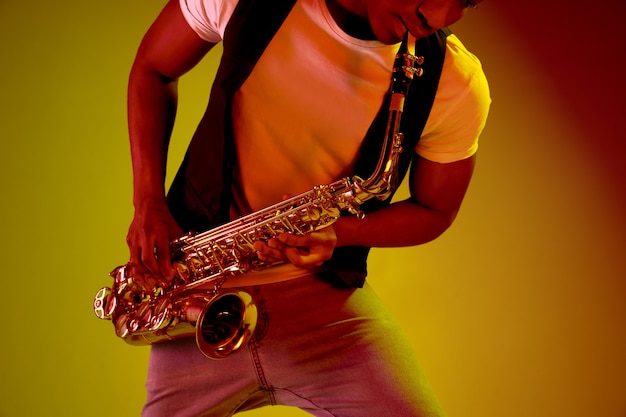 African american jazz musician playing the saxophone