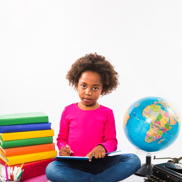 African-American kid studying in studio