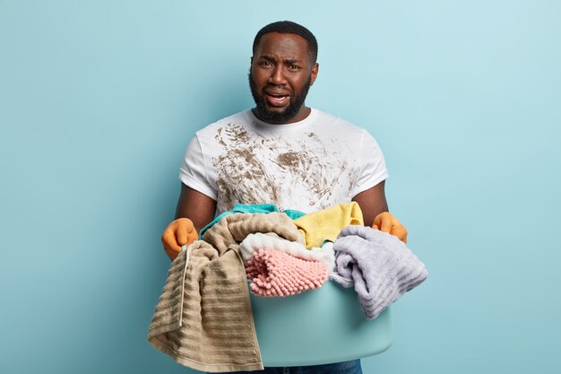 African American man doing laundry