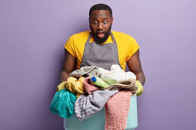 African American man doing laundry