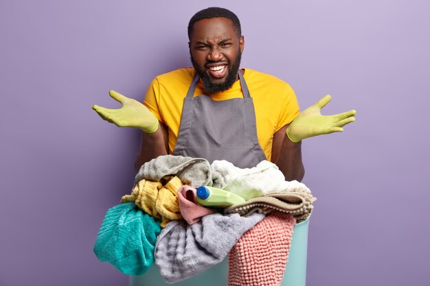 African American man doing laundry