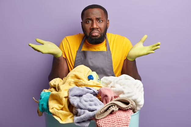 African American man doing laundry