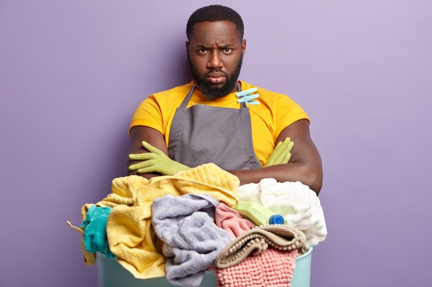 African American man doing laundry