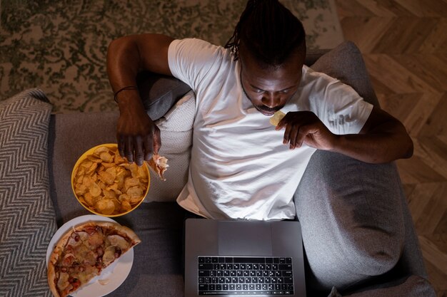 African american man eating late at night