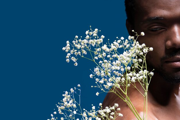 African american man holding some flowers