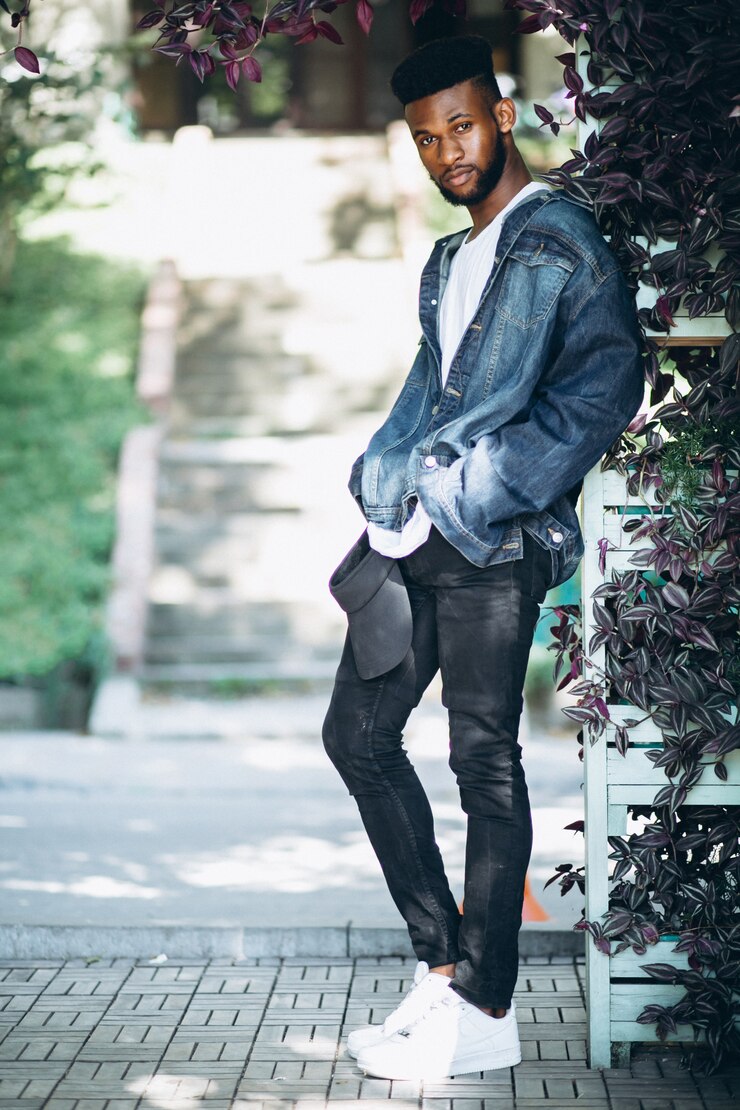 Free Photo african american man model outside in park on leaves background