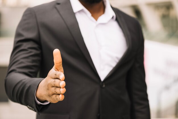 African-American man offering hand