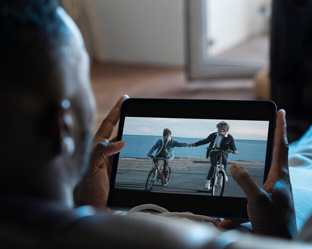 African american man watching a movie on streaming service