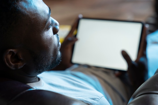 African american man watching a movie on streaming service