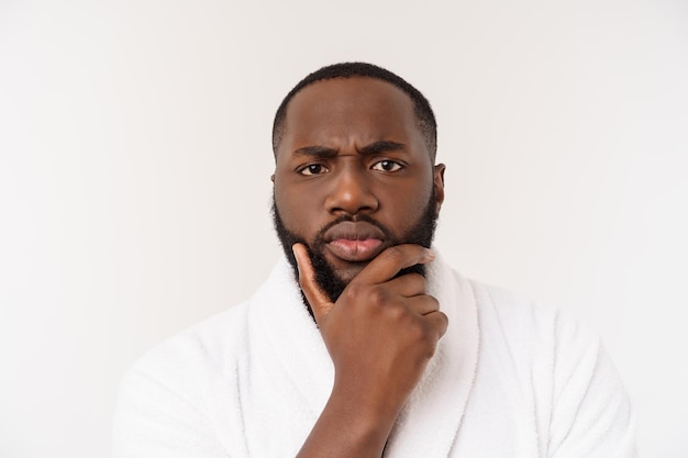 African american man wearing a bathrobe with surprise and happy emotion isolated over whtie background