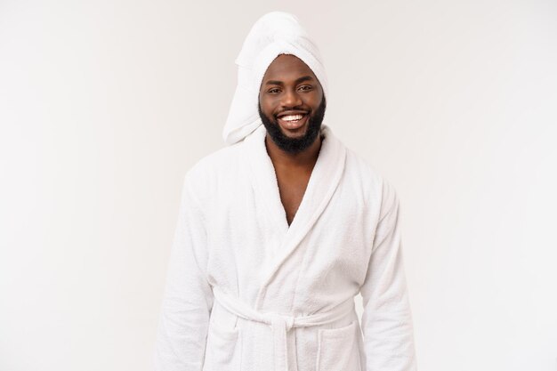 African American man wearing a bathrobe with surprise and happy emotion Isolated over whtie background