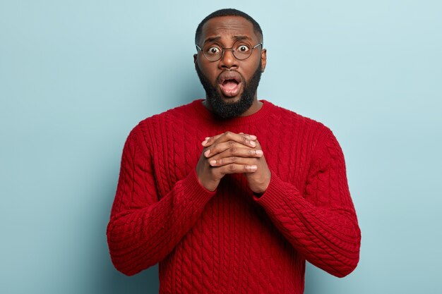 African American man wearing red sweater