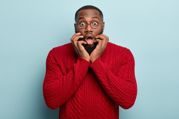 African American man wearing red sweater