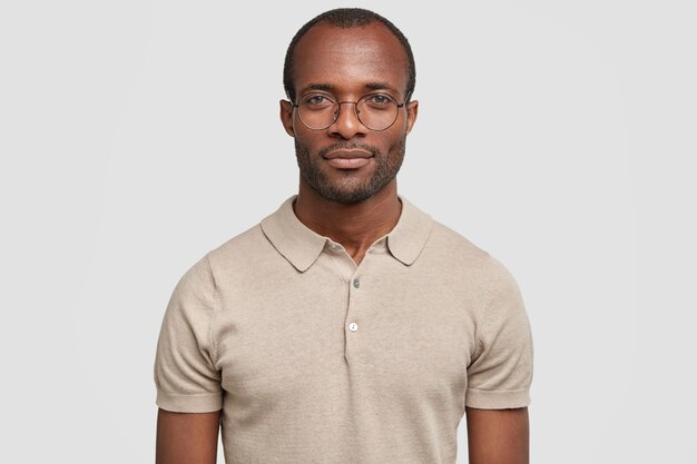 African-American man wearing round glasses