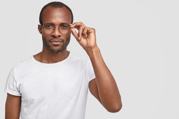 African-American man wearing round glasses