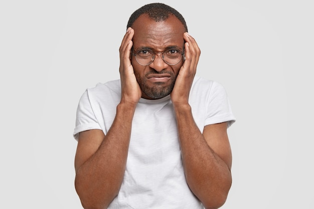 African-American man wearing round glasses