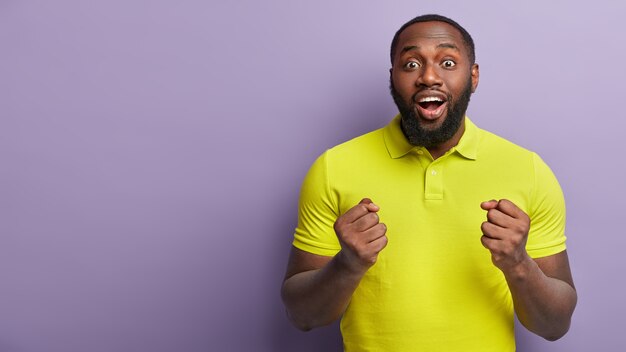 African American man wearing yellow T-shirt