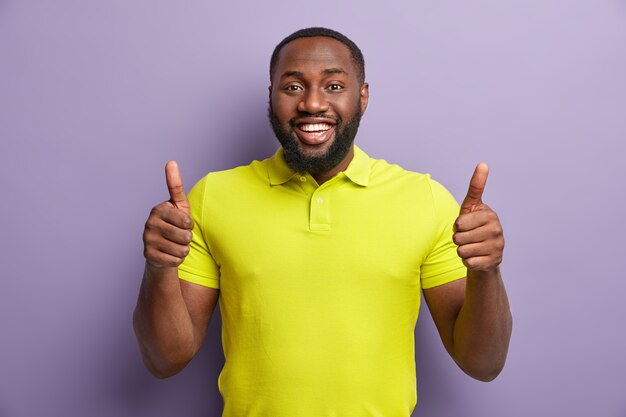 African American man wearing yellow T-shirt