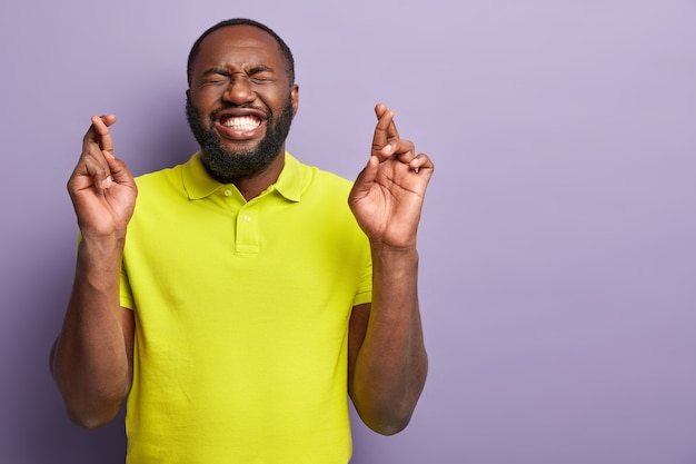 African American man wearing yellow T-shirt