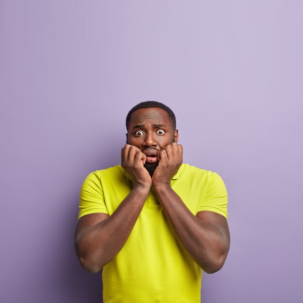 African American man wearing yellow T-shirt