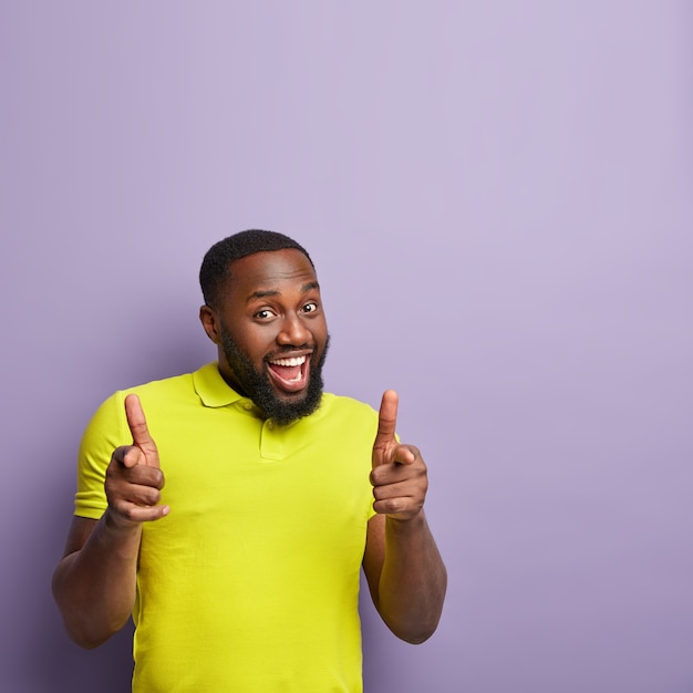 African American man wearing yellow T-shirt