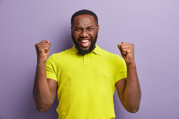 African American man wearing yellow T-shirt