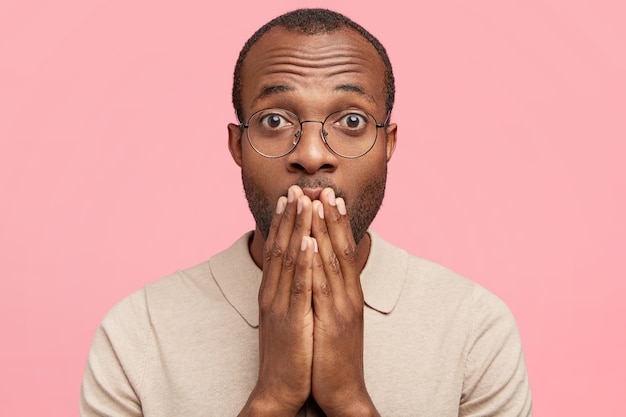 African-American man with round glasses