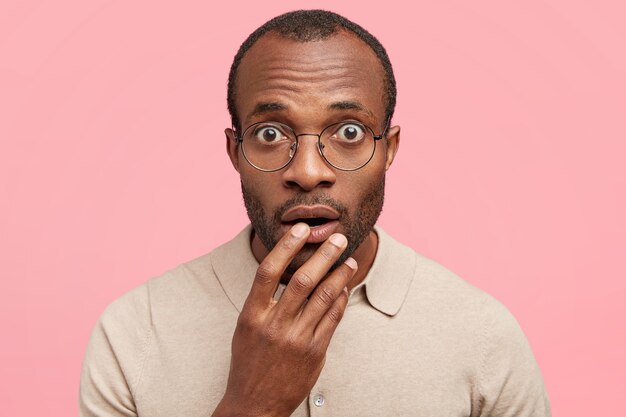 African-American man with round glasses