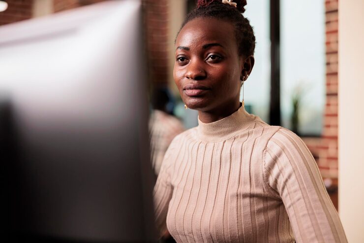 Free Photo african american programmer brainstorming ideas to write code and create new interface in data room. system engineer programming server database in busy artificial intelligence developing agency.