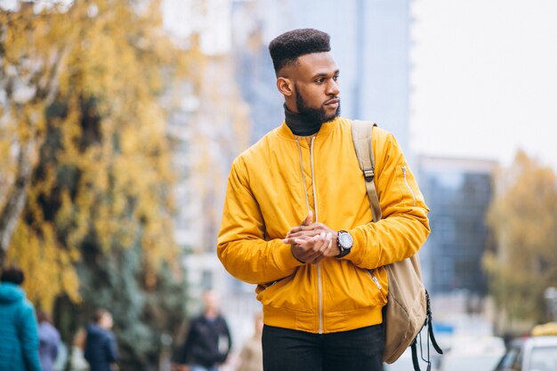 African american student walking in the street