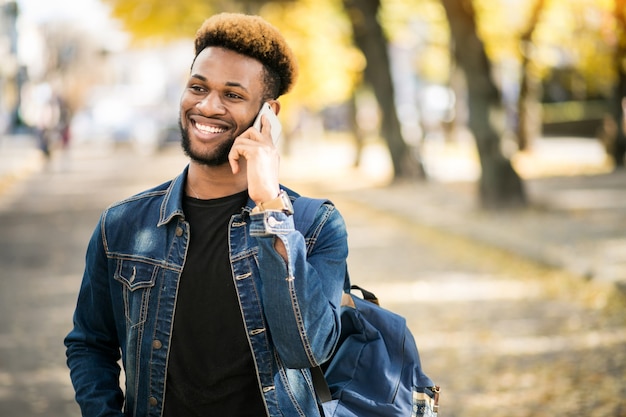 African american student with phone