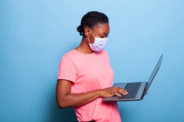 African american teenager with protective face mask against coronavirus