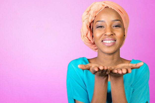 African american woman blowing a kiss