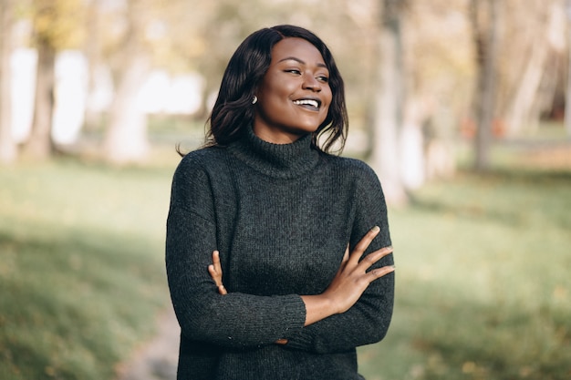 African american woman happy outside in park