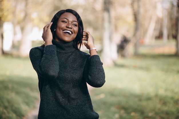 African american woman happy outside in park