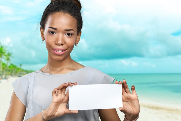 African american woman holding blank paper