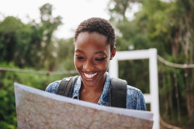 Free photo african american woman looking at a map