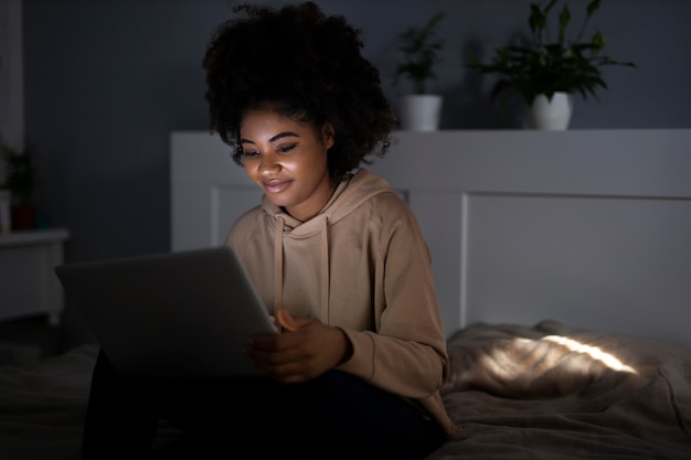 Free photo african american woman watching streaming service