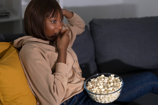 African american woman watching streaming service 