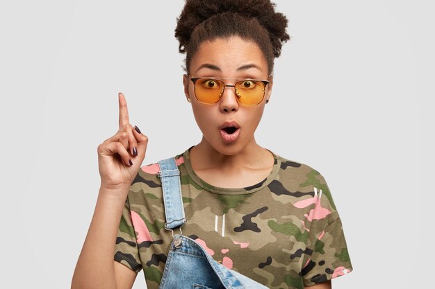 African-American woman wearing denim overalls