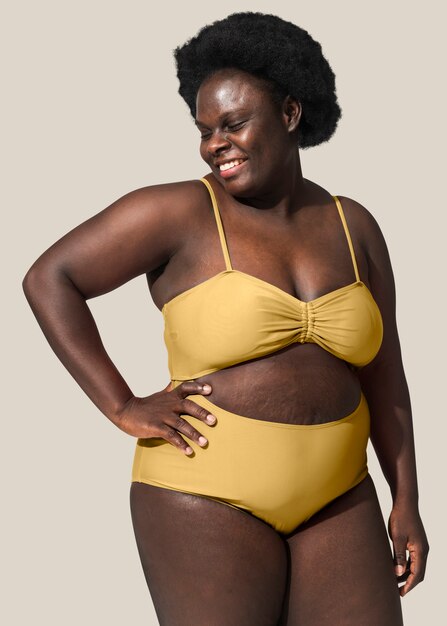 African American woman wearing yellow bikini