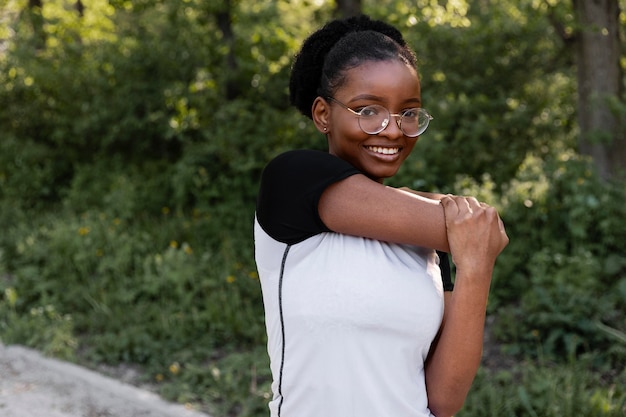 Free photo african american woman working out outdoors