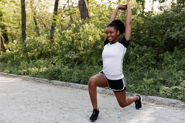 Free photo african american woman working out outdoors