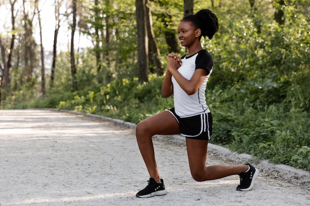 Free photo african american woman working out outdoors