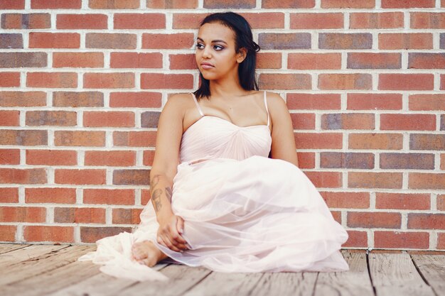 Free photo african-american young bride posing alone