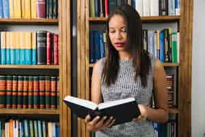 Free photo african american young lady reading book